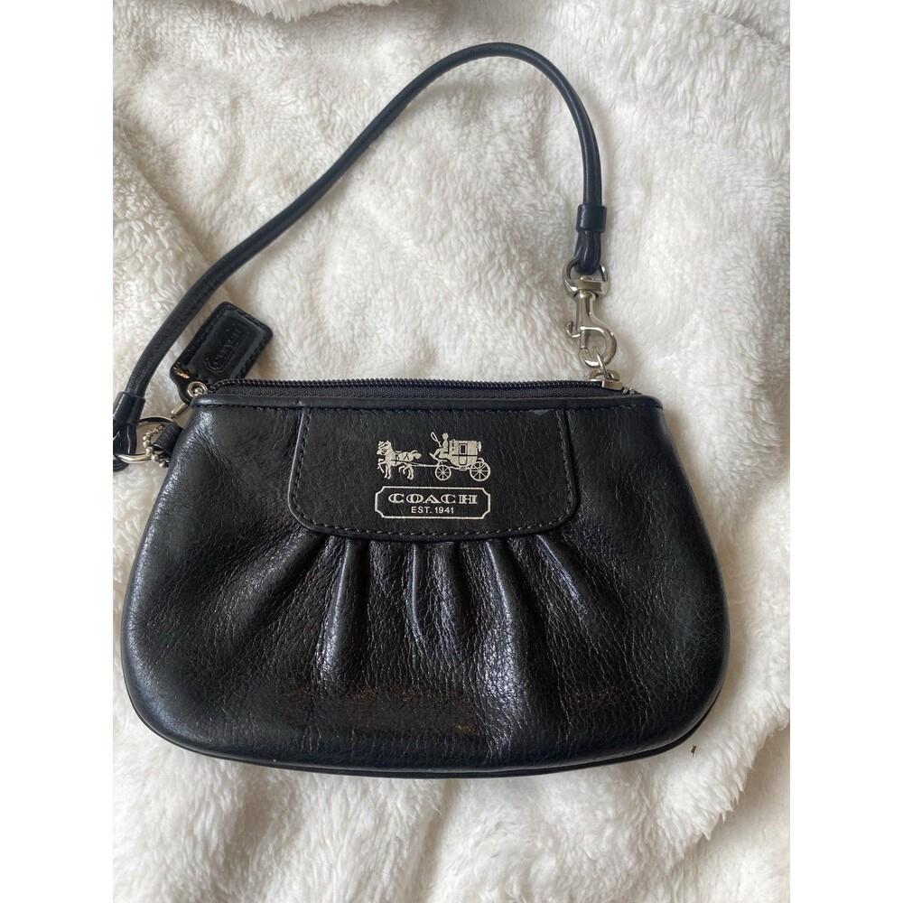 Coach Black Leather Wristlet with hang tag.  Very good condition.